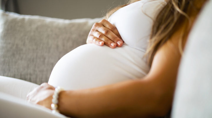 pregnant lady sitting down